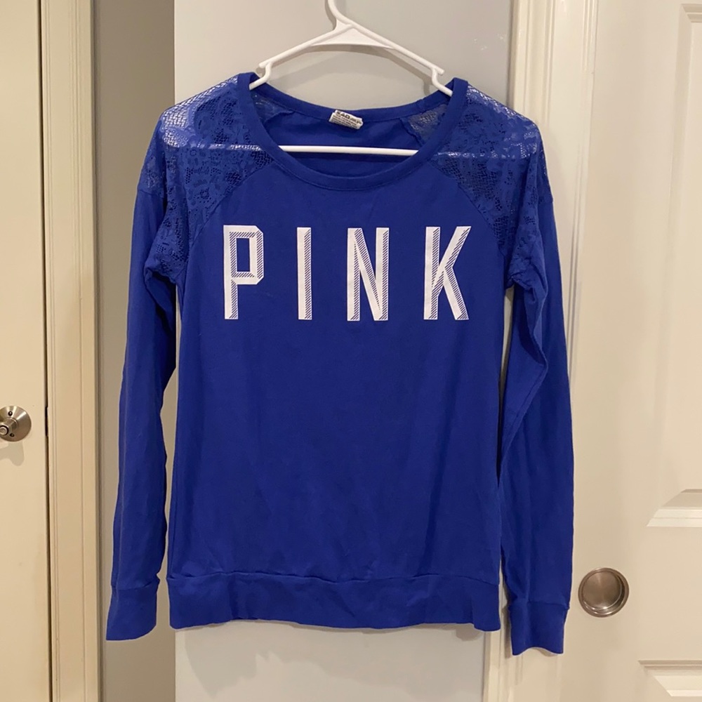 Woman’s blue long sleeved top